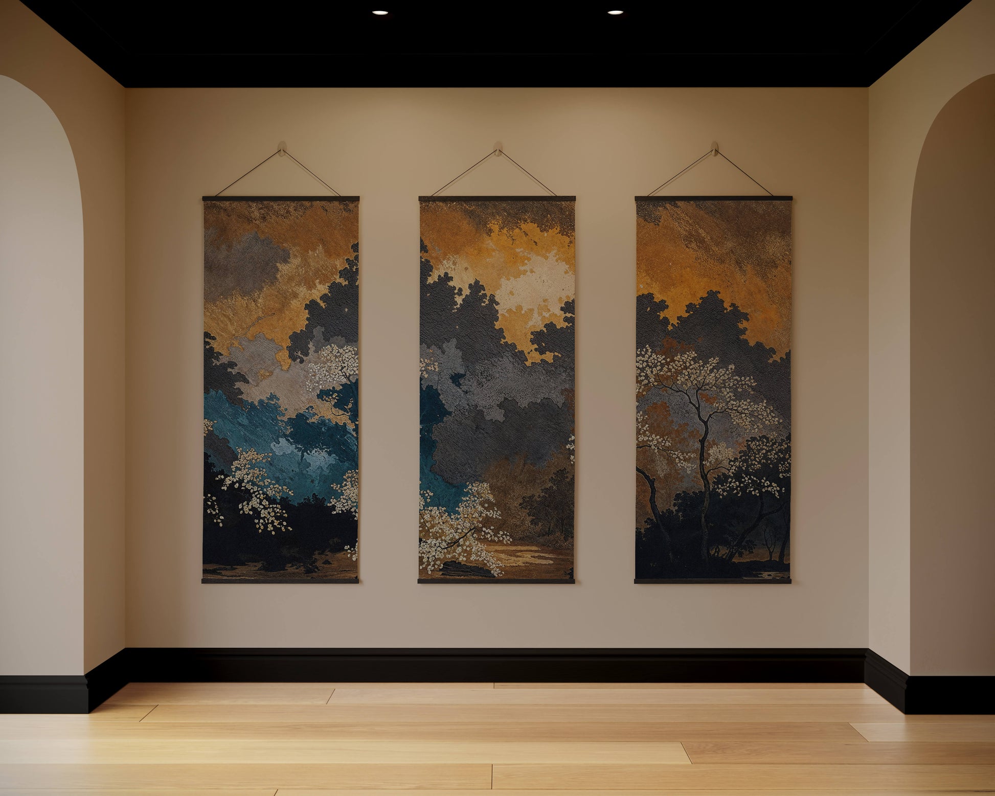 Three vertical artworks hanging on a wall in a room with wooden flooring and beige walls.