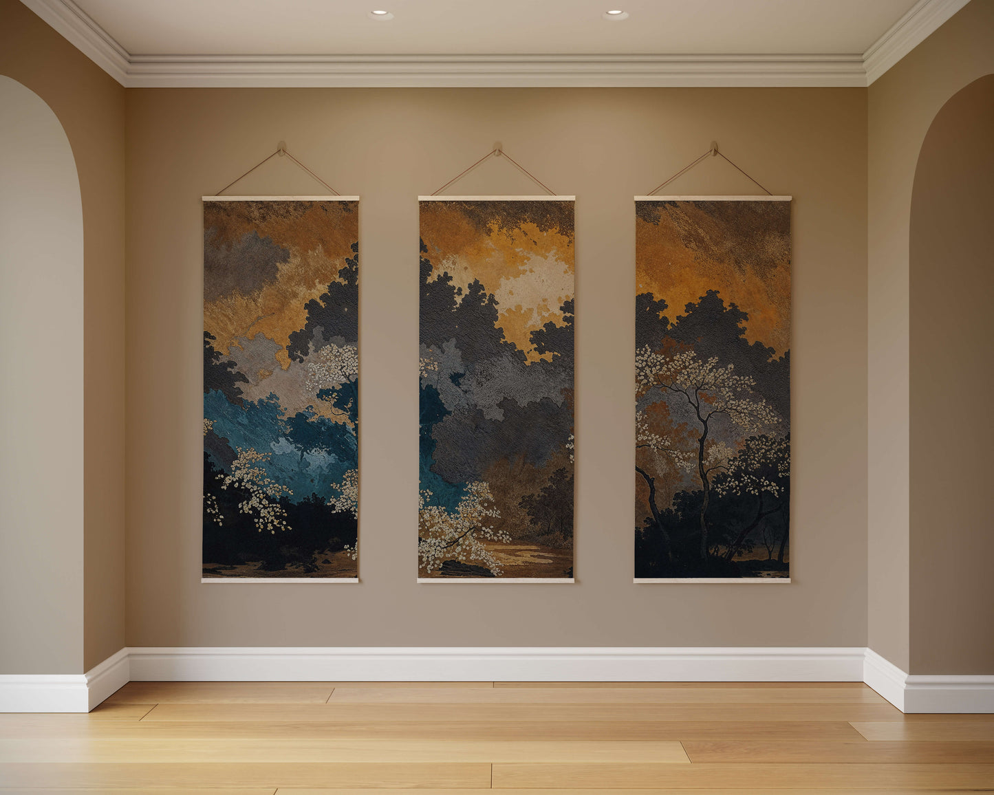 Three abstract wall hangings on a beige wall with wooden flooring.
