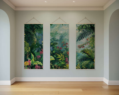 Three vertical tropical leaf artworks hanging on a light gray wall.