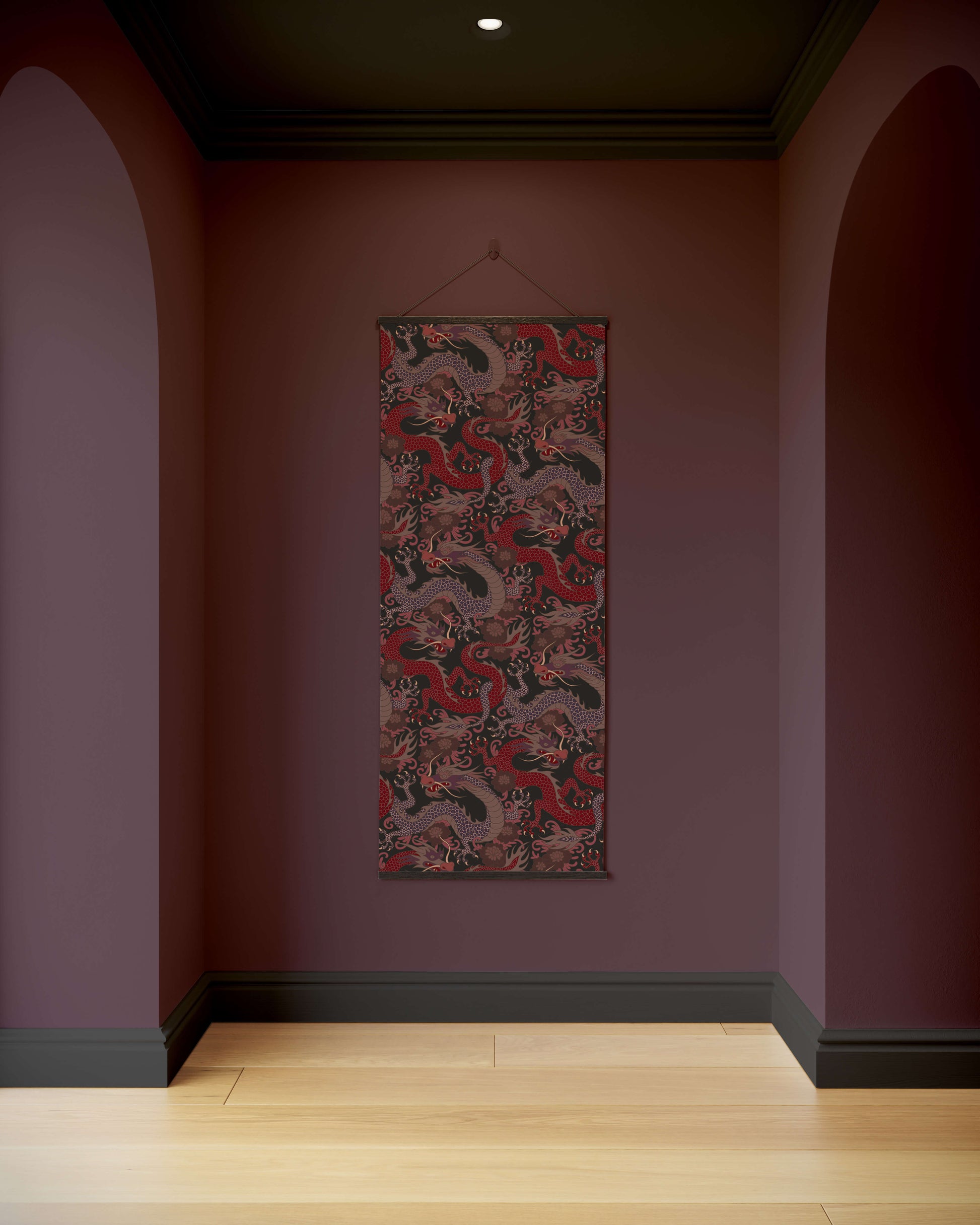 Decorative tapestry with a dragon design hanging on a purple wall.