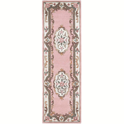 Decorative pink rug with intricate patterns on a white background