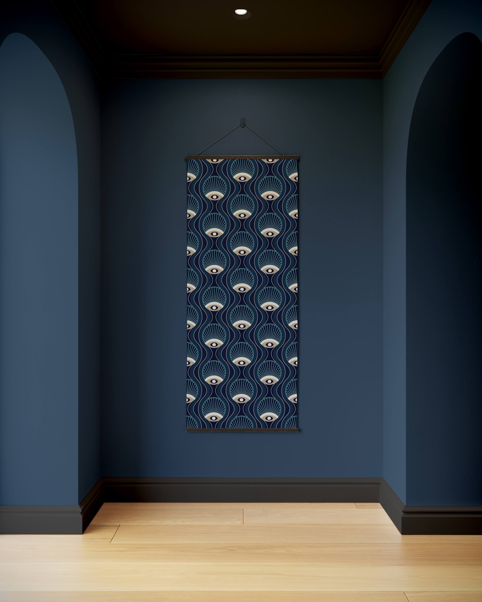Decorative wall hanging with eye pattern on a blue wall