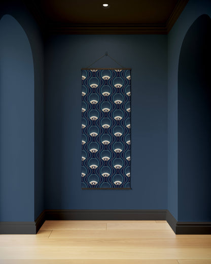 Decorative wall hanging with eye pattern on a blue wall