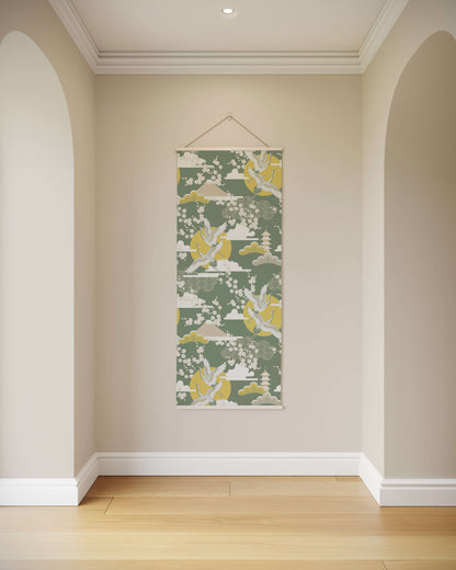 Decorative wall hanging with a green and yellow pattern on a beige wall.