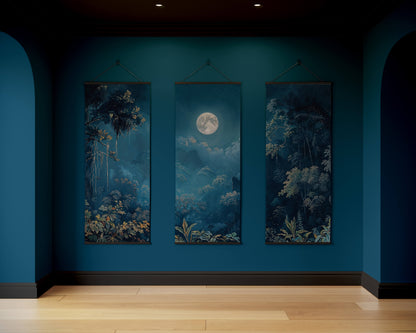Three framed artworks on a blue wall with a wooden floor.