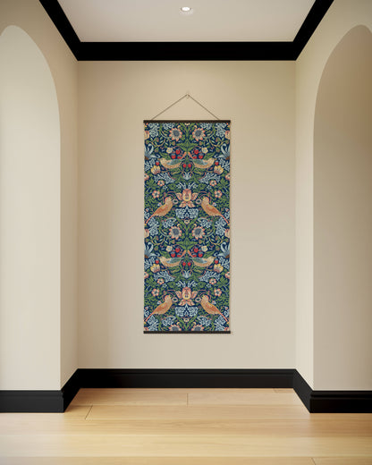 Decorative floral tapestry hanging on a wall with arches and a wooden floor.