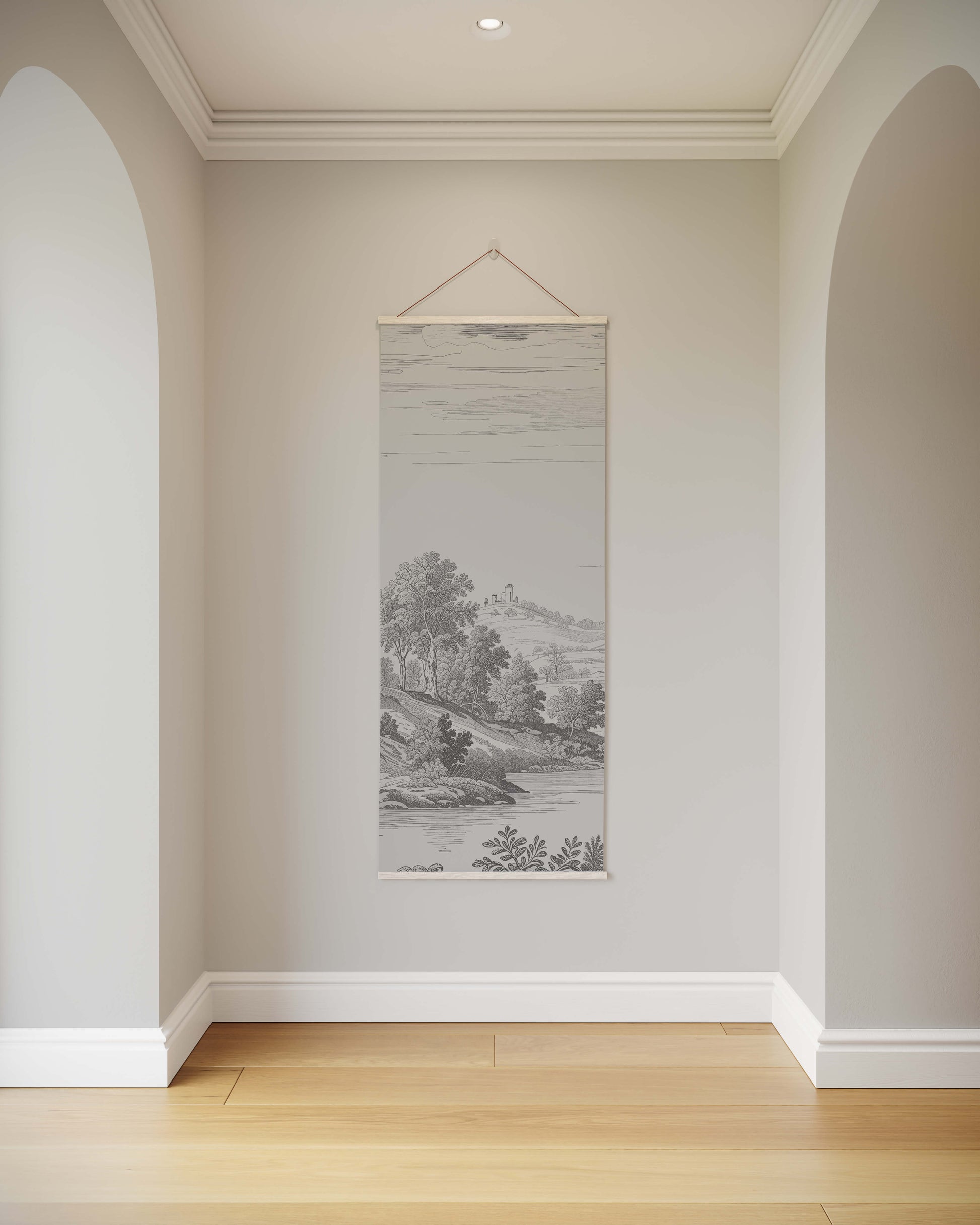 Wall art hanging in a room with arched doorways and a neutral color scheme.