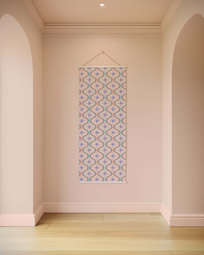 Decorative tapestry with a geometric pattern hanging on a wall in a room with arches.