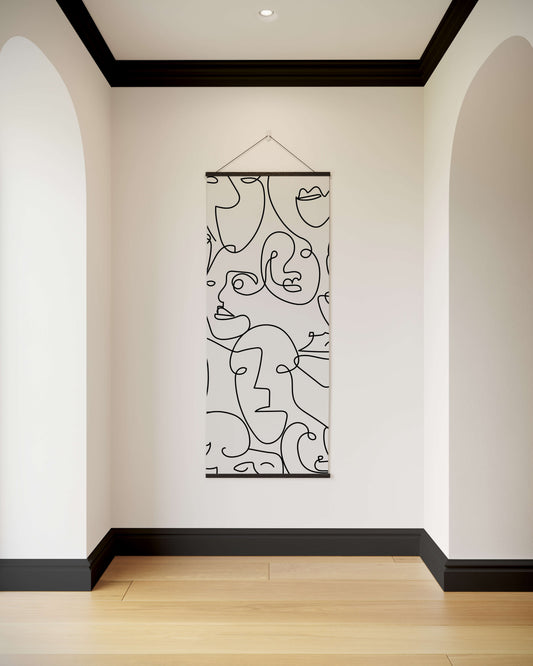 Abstract line art of faces on a wall in a modern hallway