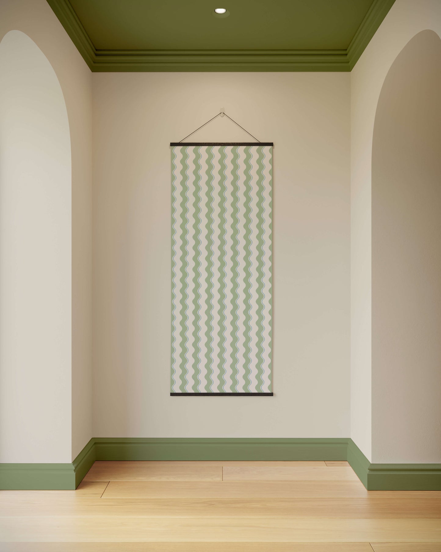 Wall with a hanging decorative panel in a room with green and beige walls.