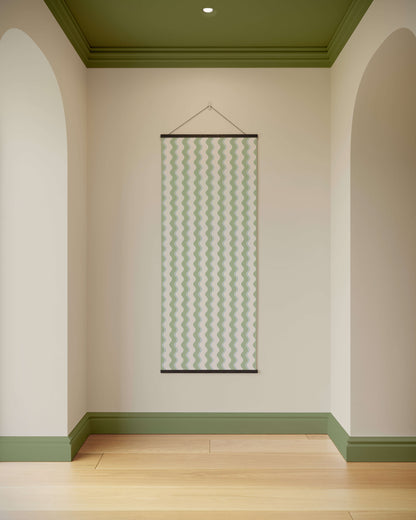 Wall with a hanging decorative panel in a room with green and beige walls.