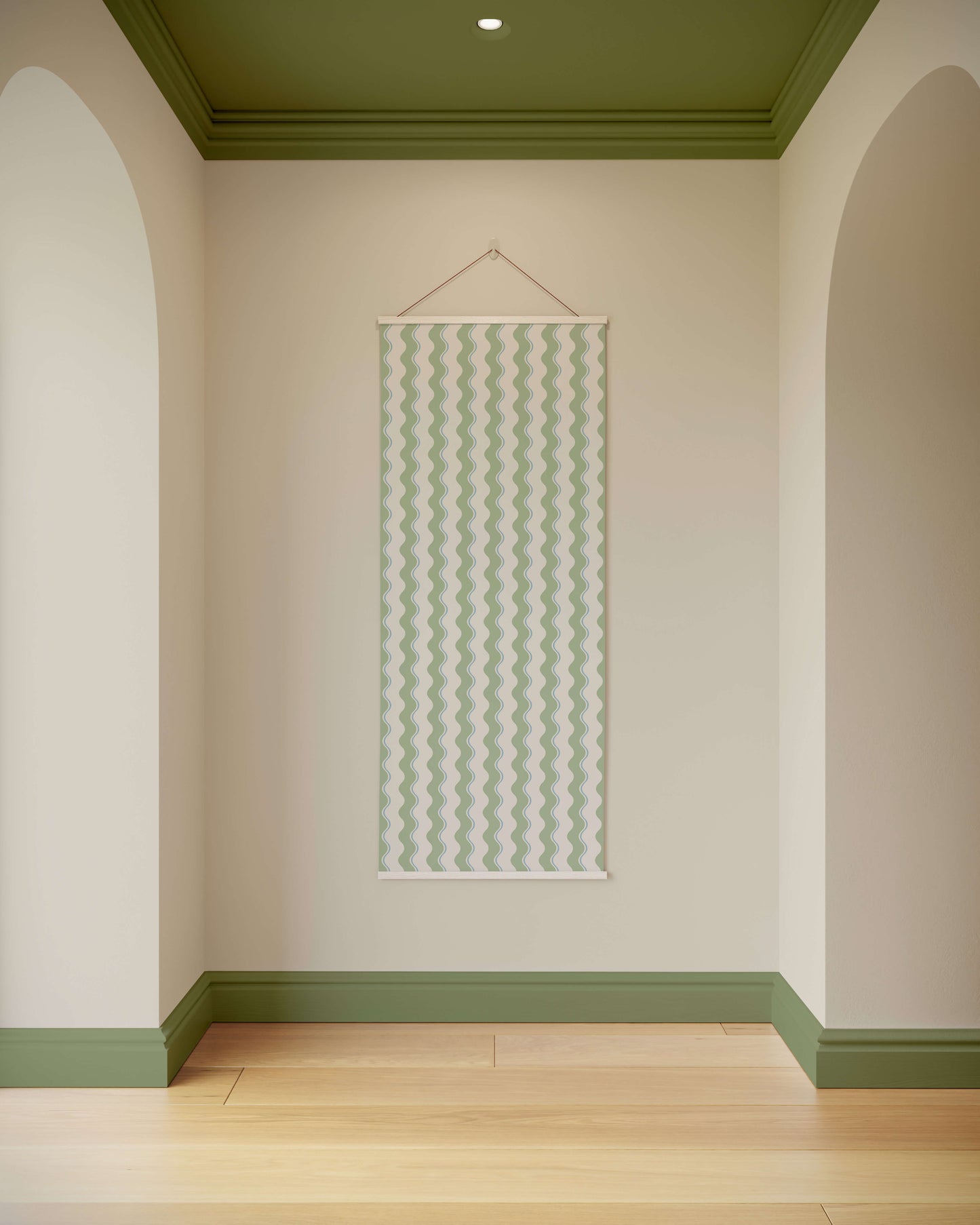 Wall with a decorative hanging panel in a room with green ceiling and baseboards.