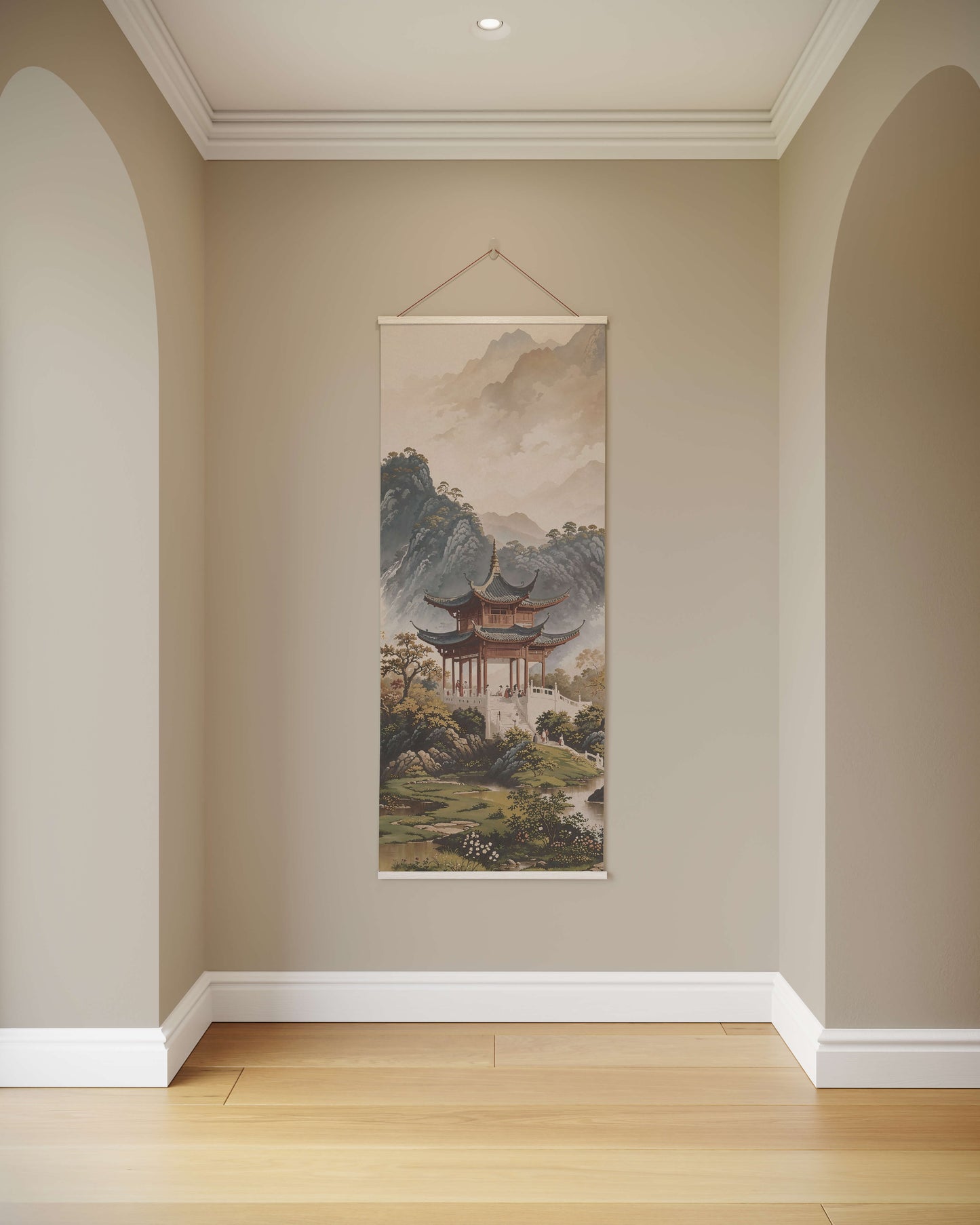 Wall art hanging on a beige wall in a room with wooden flooring.
