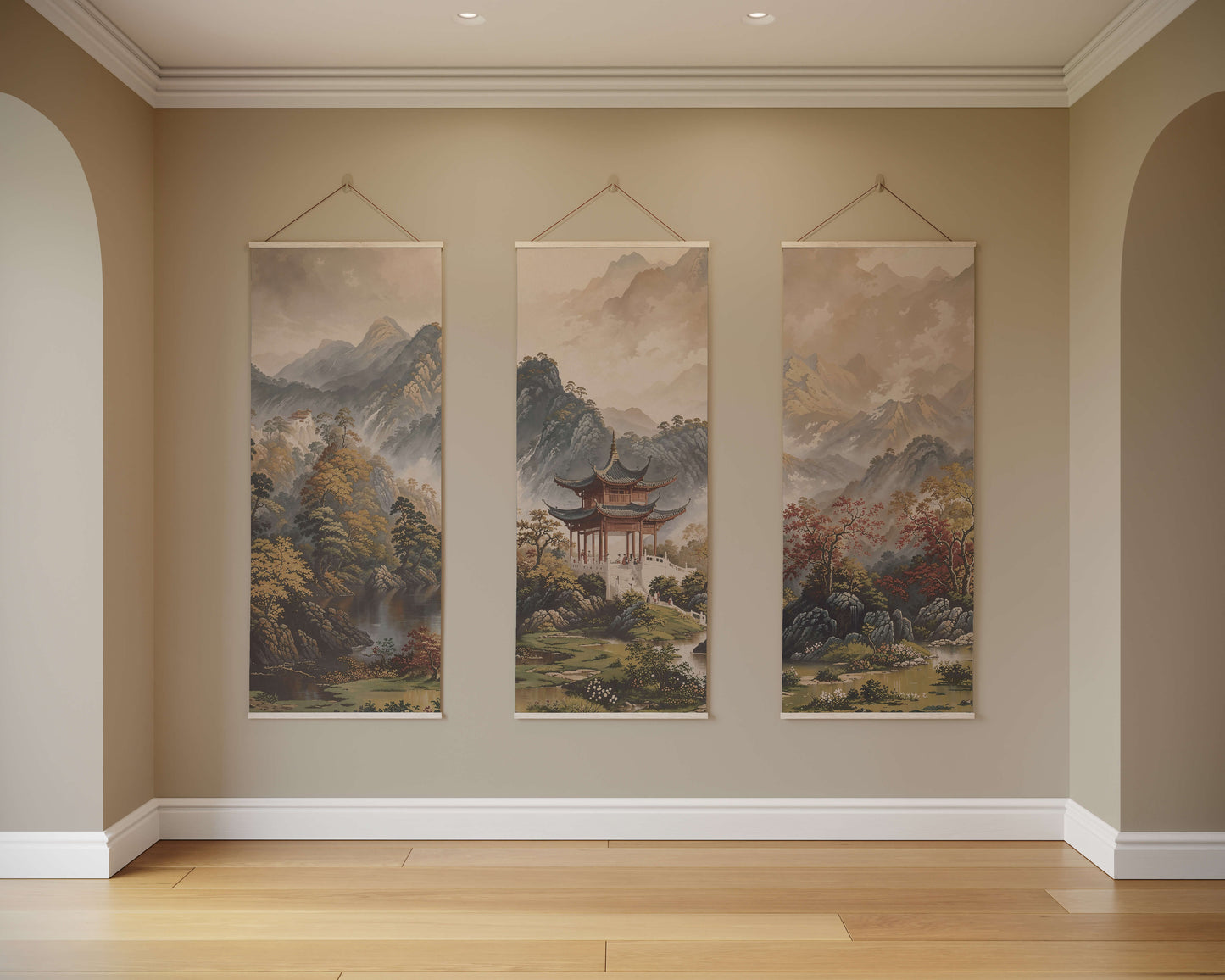 Three hanging tapestries depicting mountain landscapes on a beige wall.