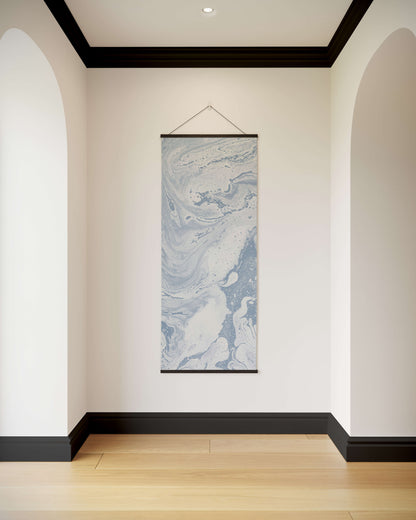 Marble-patterned wall scroll hanging on a plain wall with a wooden floor.
